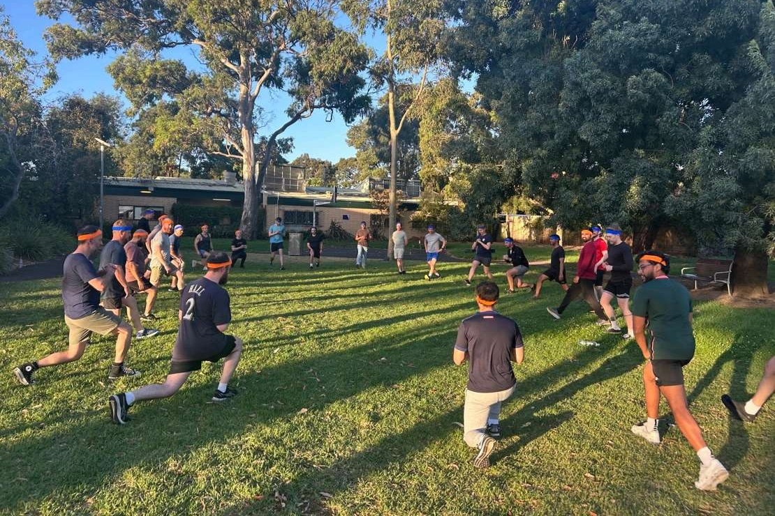 Dads exercising together outdoors at a City of Port Phillip Dadfit session
