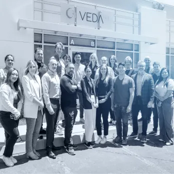 The VedaBio team standing outside the office for a group photo.