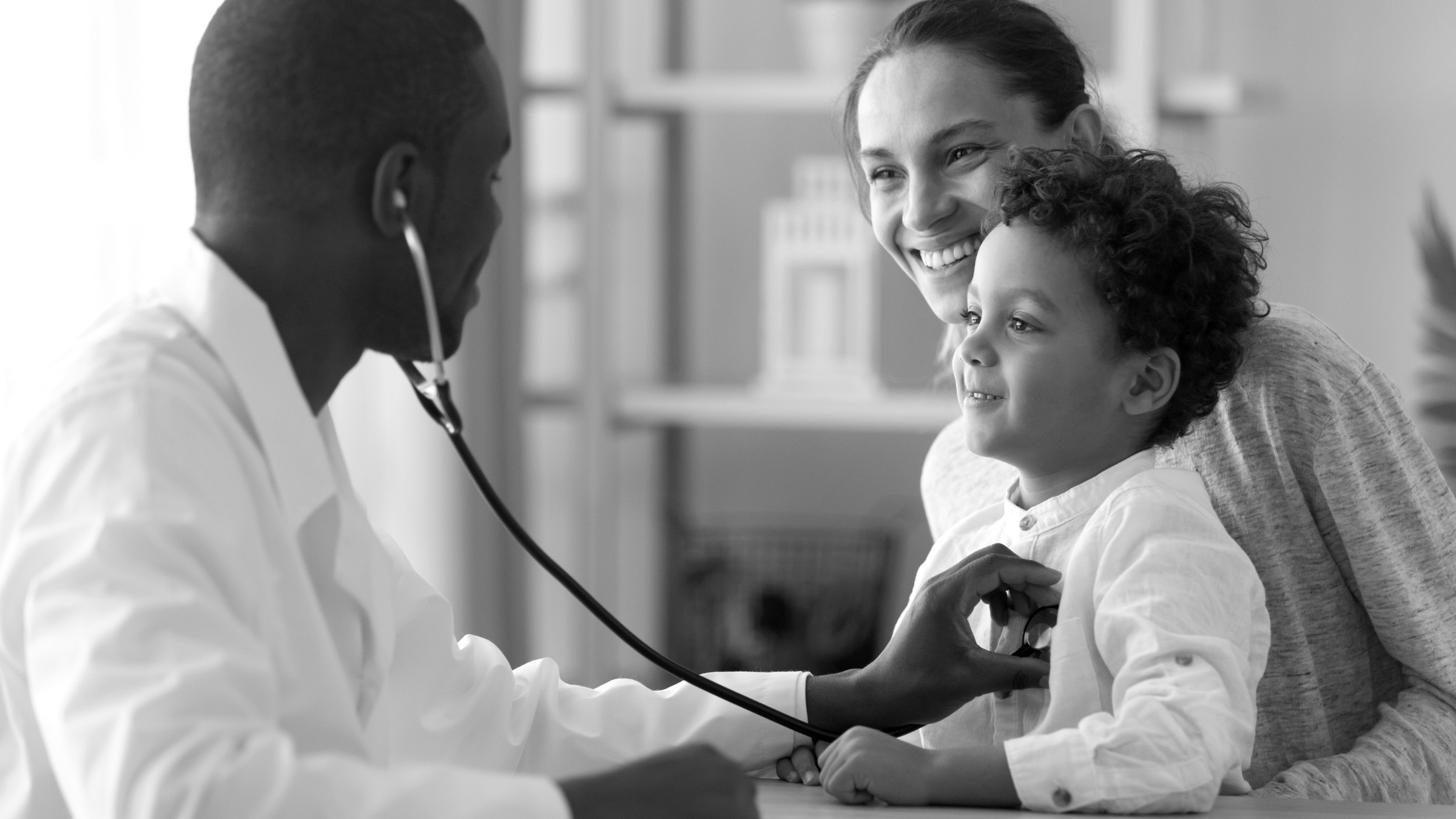 A clinician examining a child during an urgent care visit