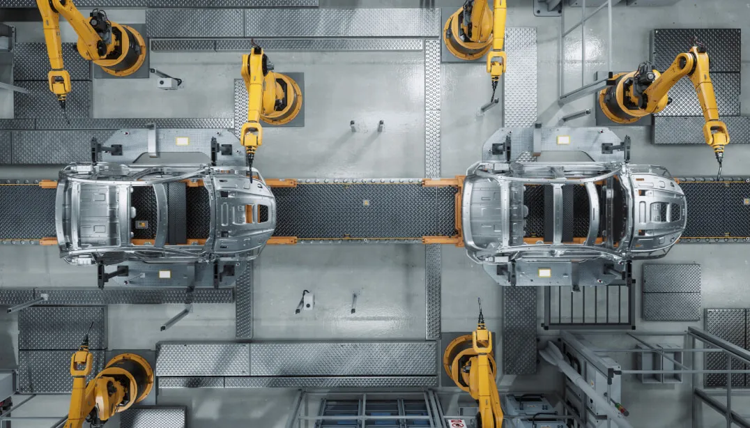 Mechanical arms near a conveyor belt.