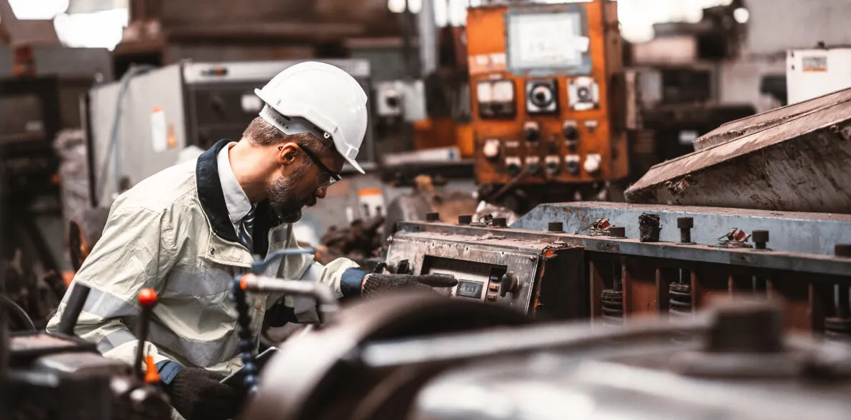 An engineer inspecting a machine.