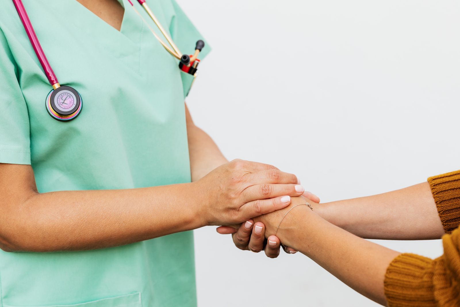 Physician giving a warm, reassuring consultation to a patient