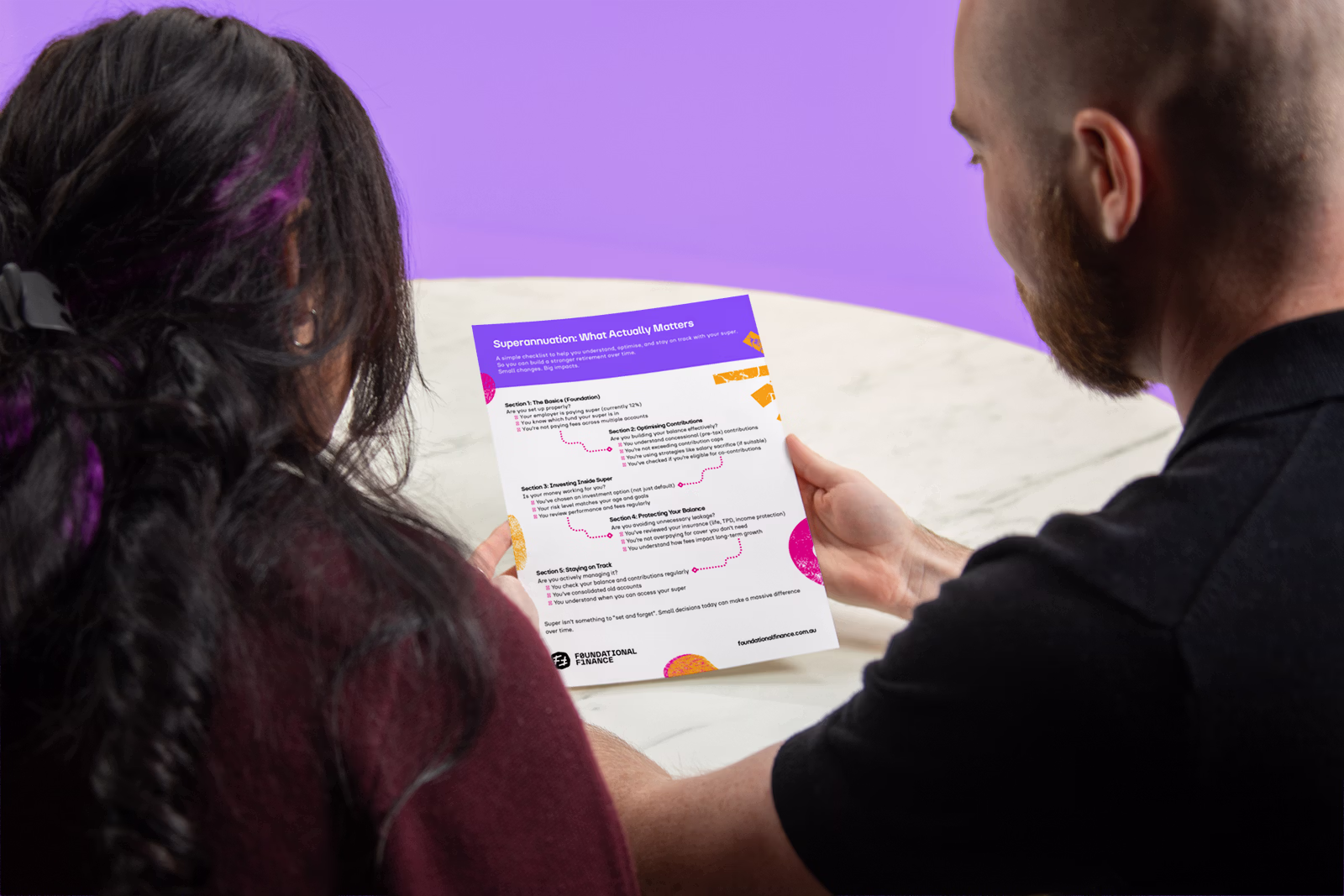 Two people viewed from behind read a document titled 'Superannuation: What Actually Matters.'