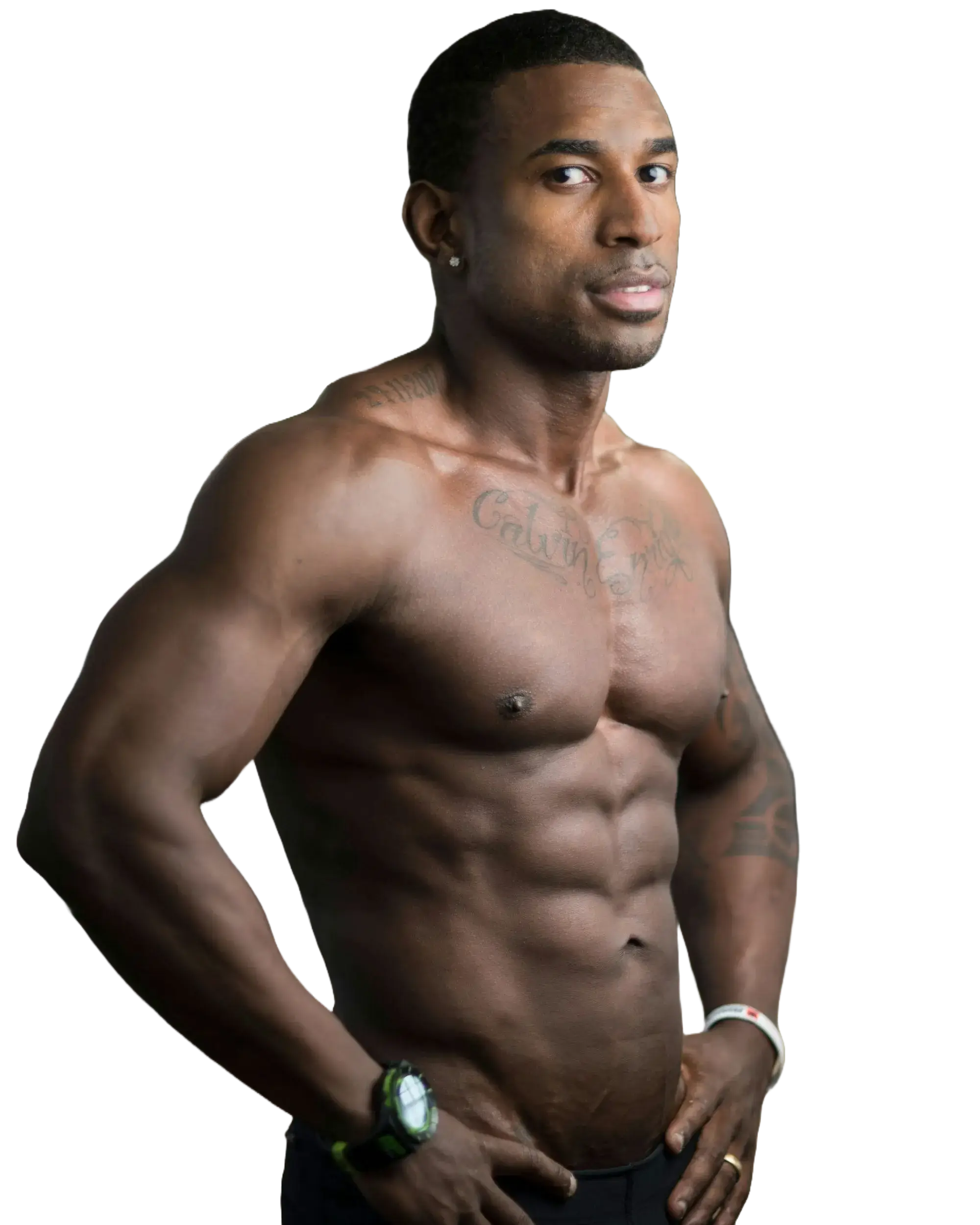 Muscular shirtless man with tattoos posing with hands on hips, wearing a watch and bracelet.