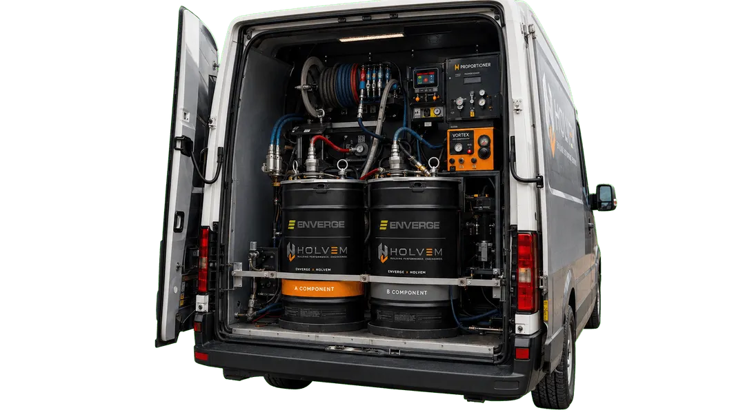 HOLVEM spray rig van with Enverge NexSeal LE A and B component drums plumbed into the proportioner.