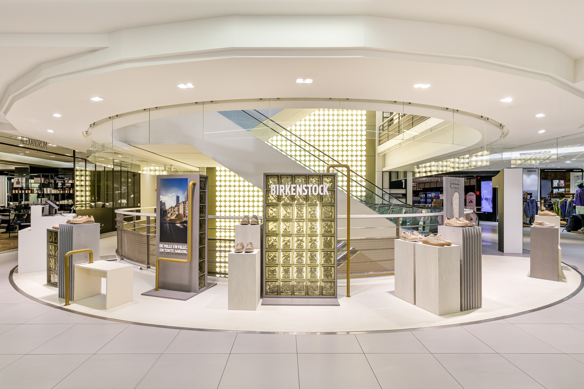 Birkenstock pop-up at Galeries Lafayette Paris: circular display with illuminated glass-block wall