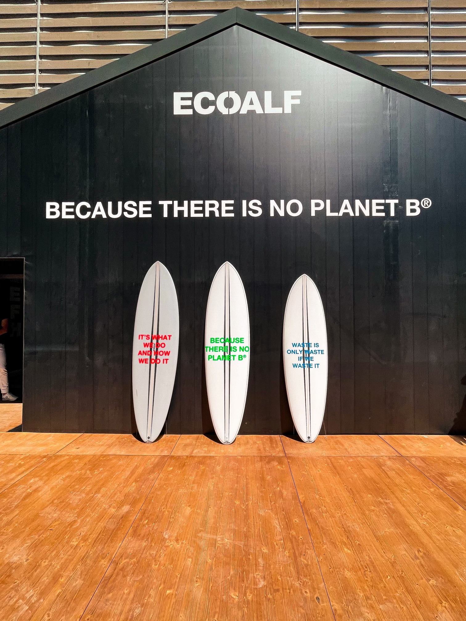 ECOALF display “Because there is no Planet B” with three surfboards bearing sustainability slogans