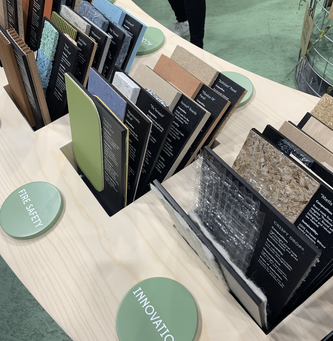 Sustainable material samples labelled “Fire Safety” and “Innovation” on display at EuroShop.