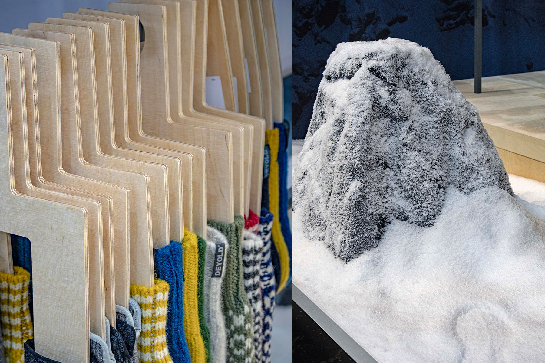 Detail: Zickzack-Holzständer mit Devold-Socken und schneebedeckte Felsformation als Deko.