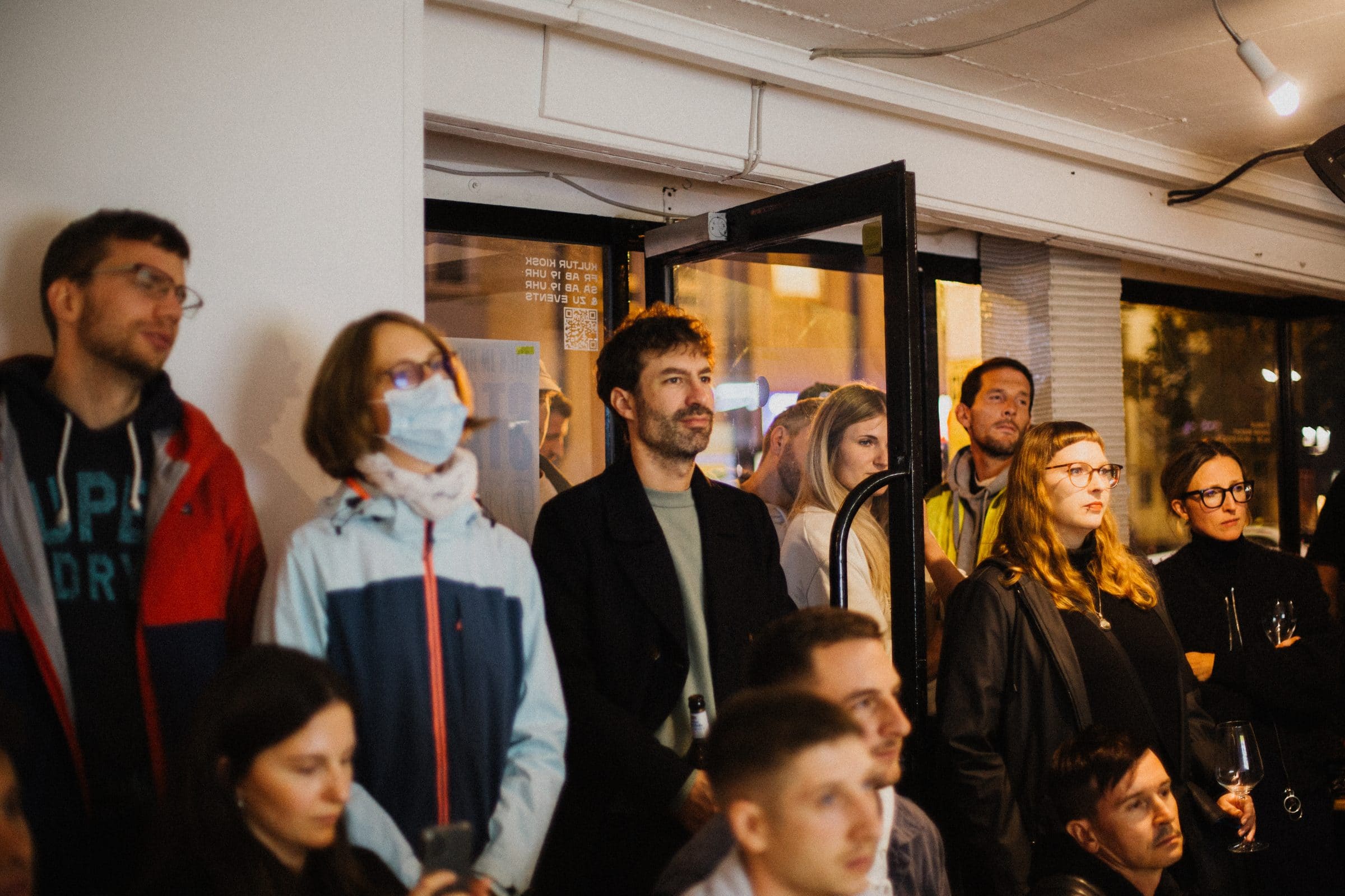 Audience listens attentively to a talk indoors