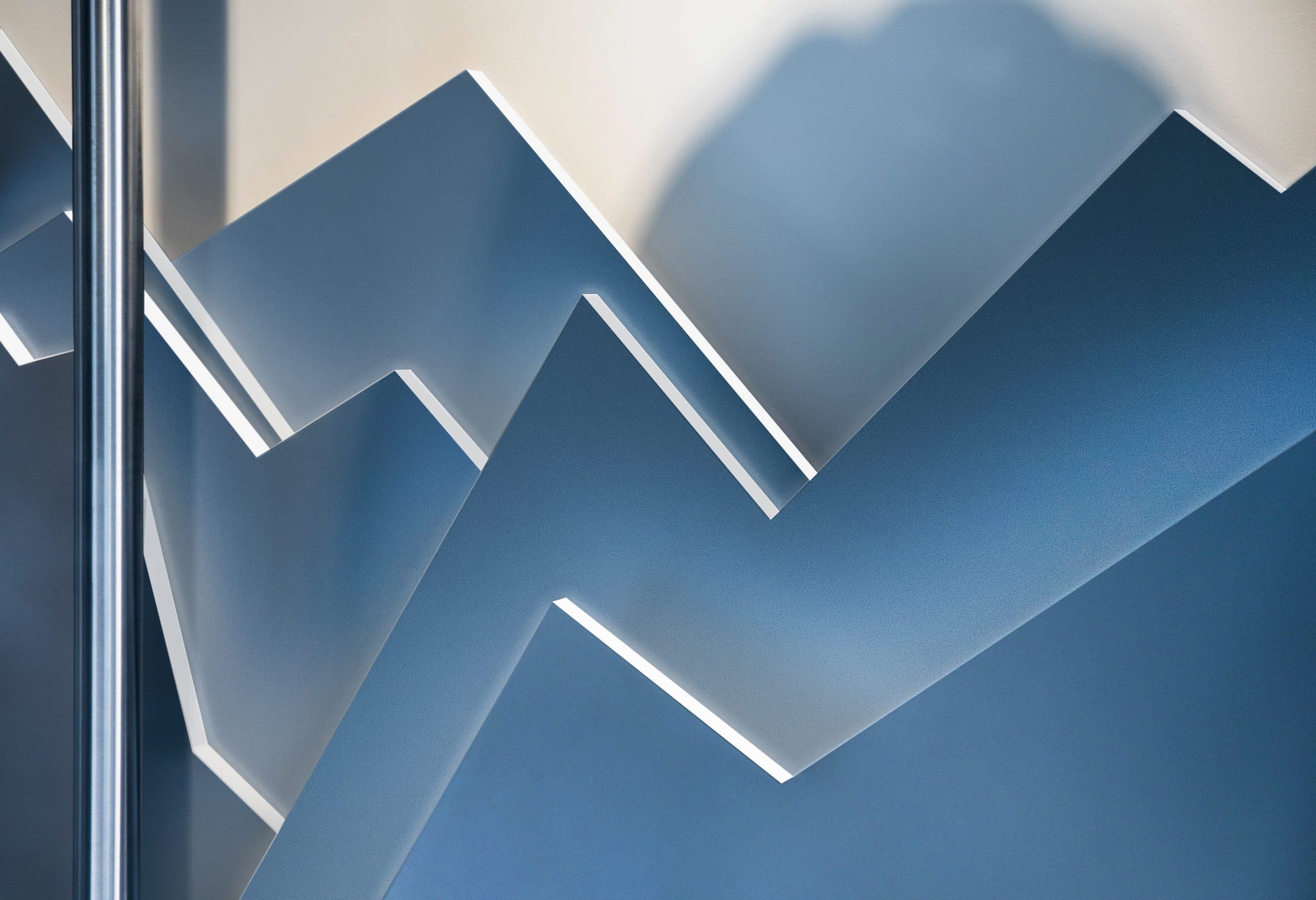Detail shot of a mountain-shaped, blue-lit wall panel used in the window design.