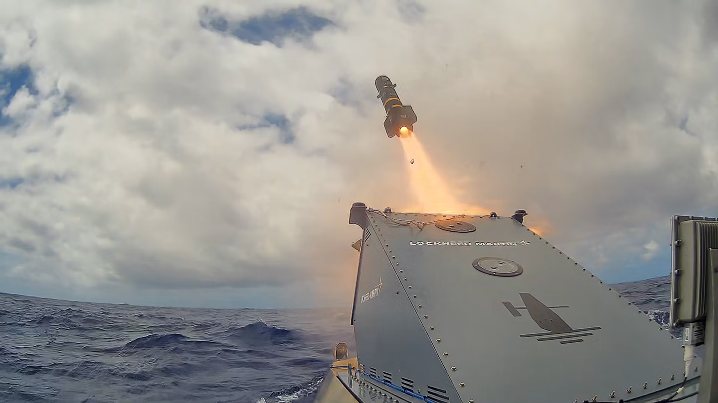 A missile fires from Lockheed Martin's JAGM launcher, integrated onto a Saildrone Surveyor USV