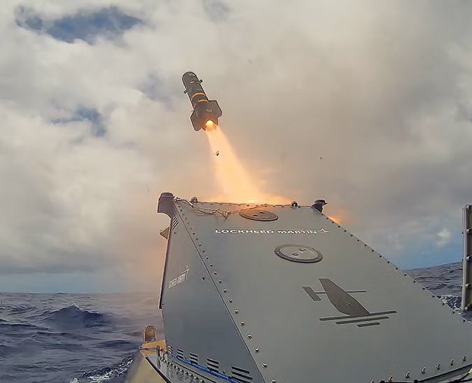 A missile fires from Lockheed Martin's JAGM launcher, integrated onto a Saildrone Surveyor USV