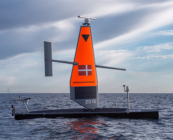 Saildrone Voyager unmanned surface vehicle in the Baltic Sea with the Øresund Bridge in the background.