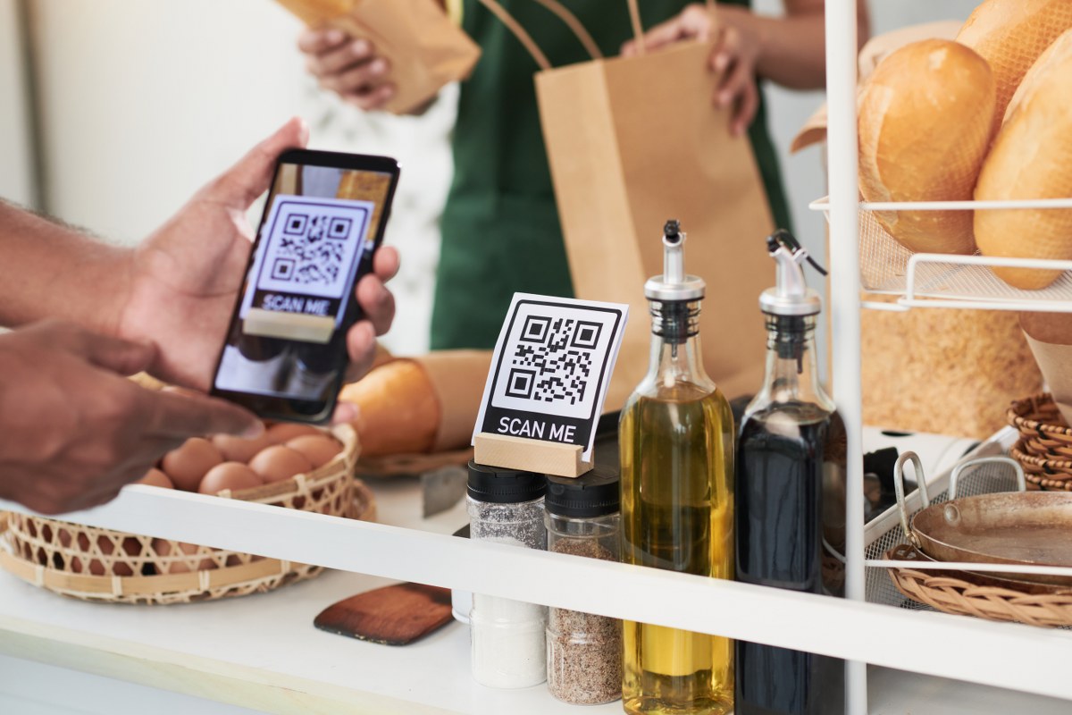 A person using a QR code to research a product