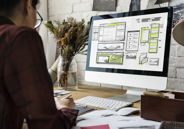 A person working on a website with mobile optimization in mind.