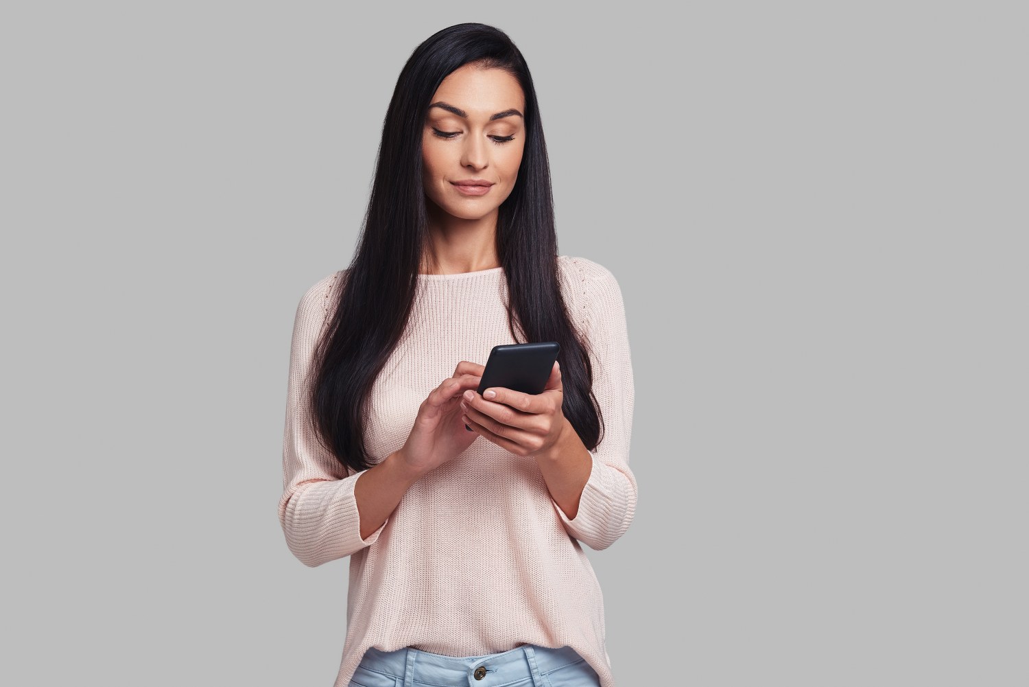 A girl using an app on her phone