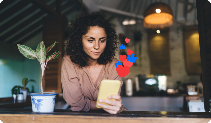 A woman watching marketing content on her phone.