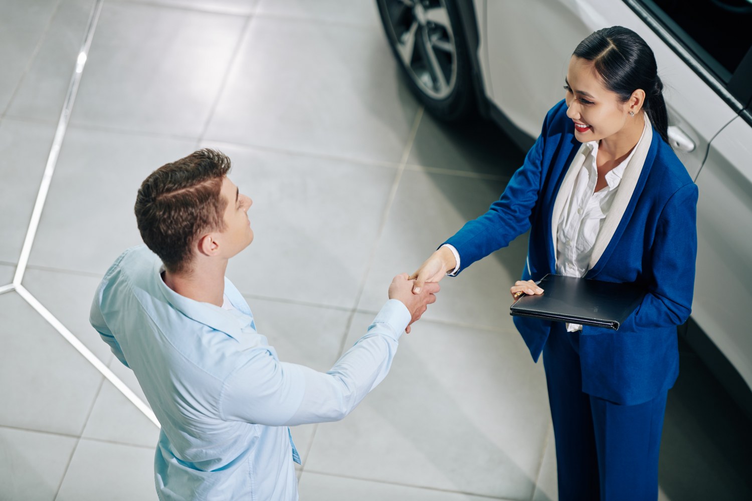  A business person shaking hands with a customer