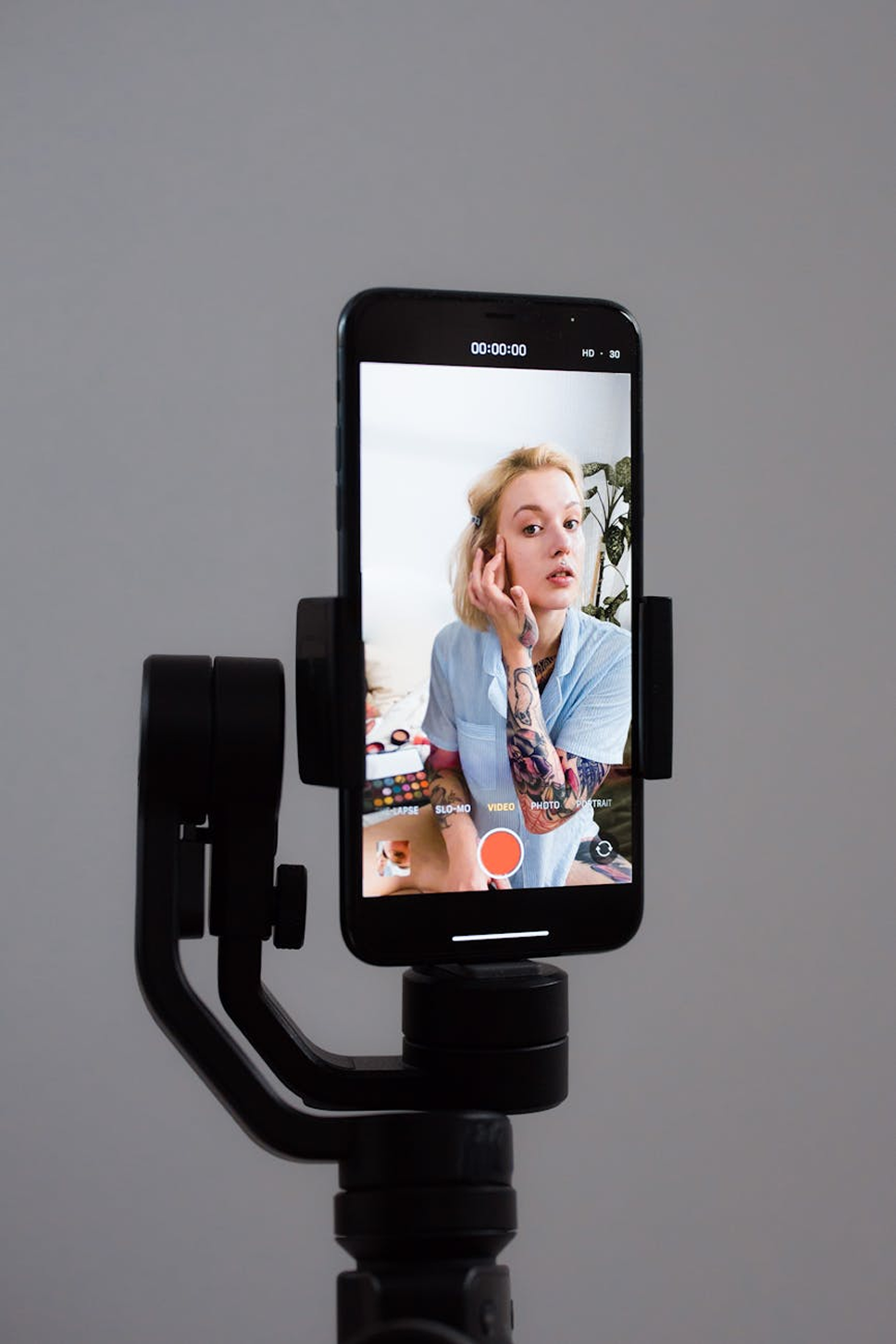 A worker making a behind the scenes vertical video.