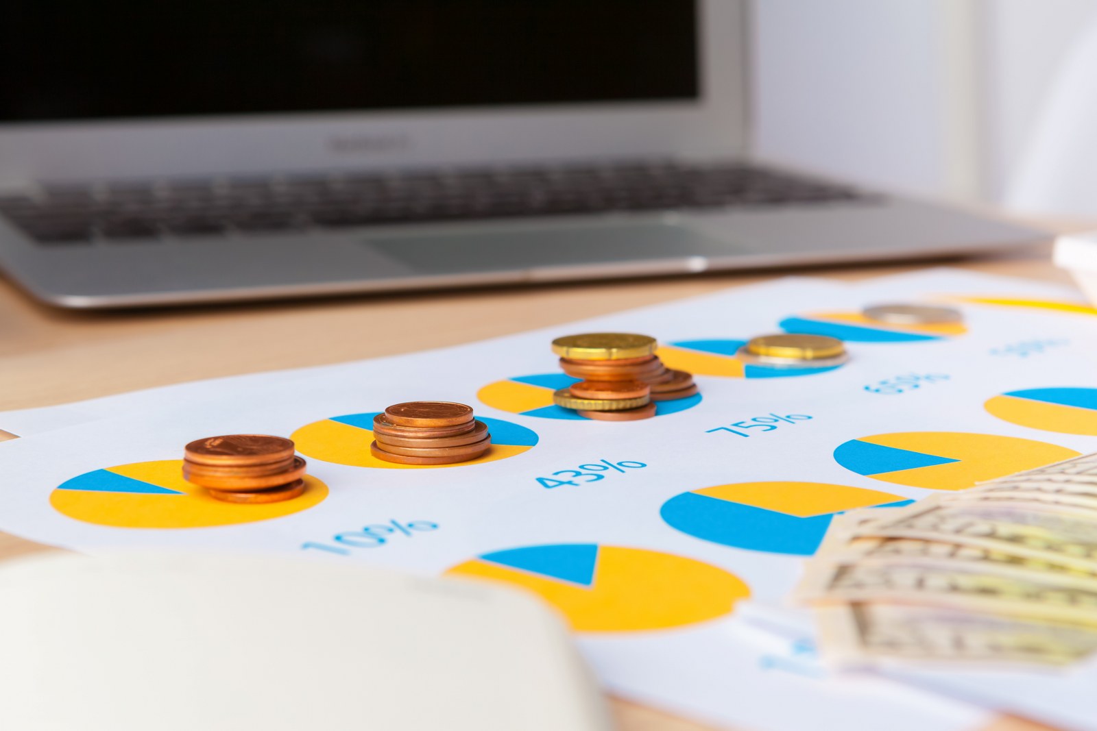 A chart with coins and analytics regarding revenue