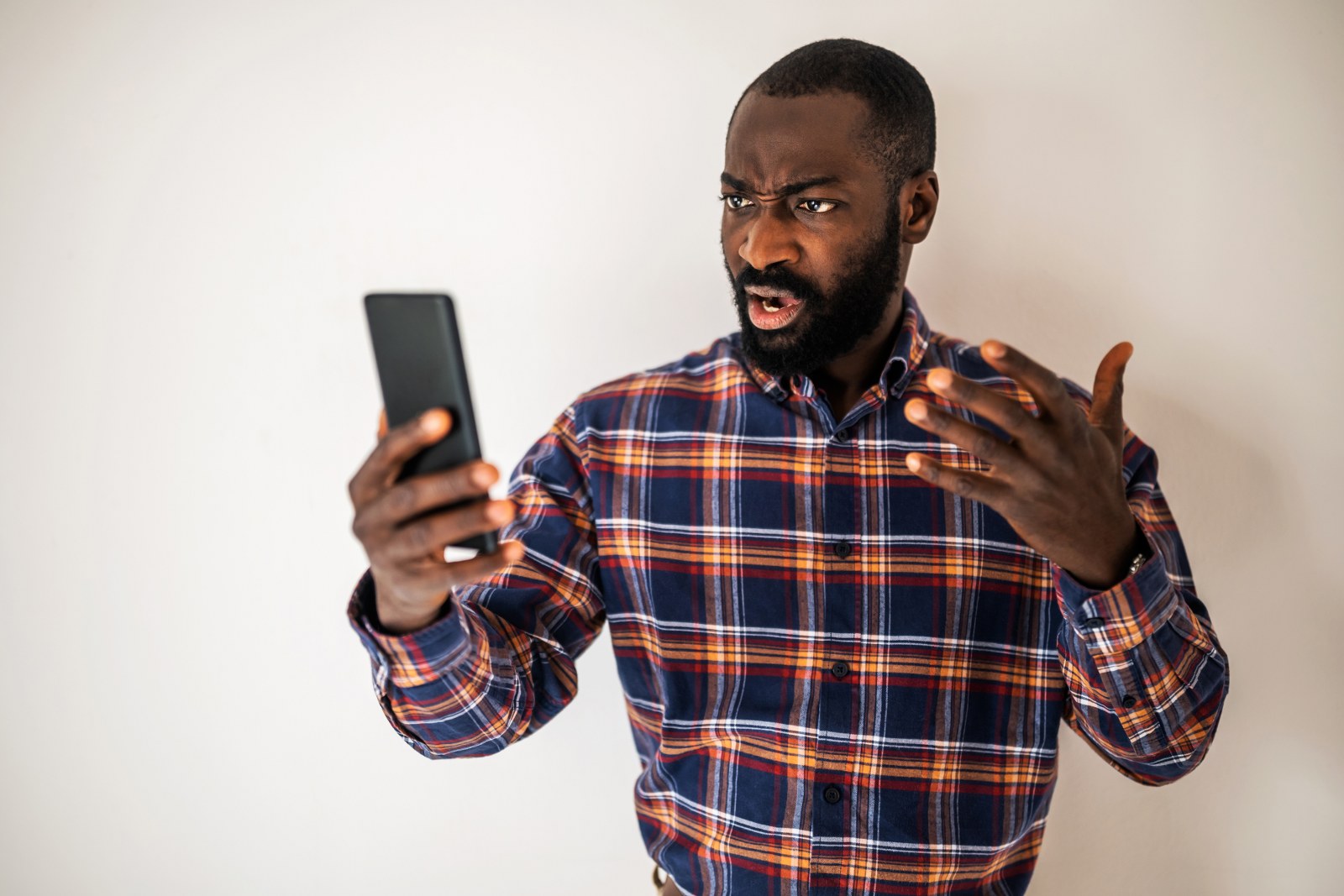 A person feeling annoyed while watching a story ad on their phone.