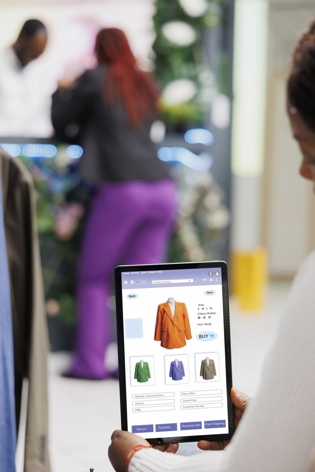 A woman using a tablet while shopping in a store, showing why first-party data is the goldmine of retail media, especially when combined with AI.