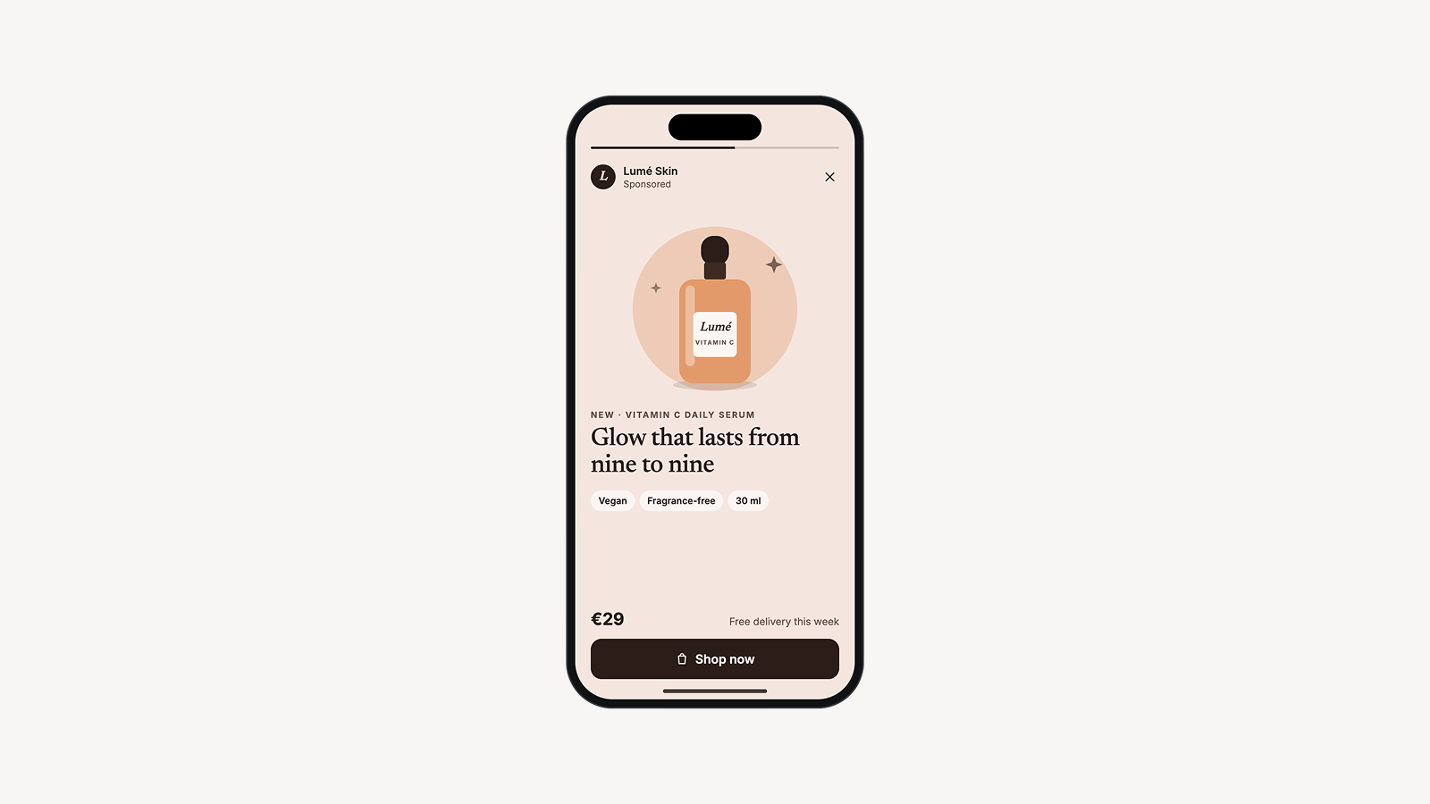 Smartphone showing a full-screen sponsored story ad for a vitamin C face serum, with a product illustration, price and “Shop now” button.