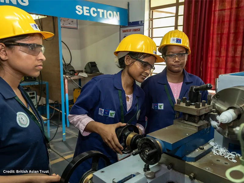 Photo of Young women receive training in operating automotive machinery through the Government of India–led Skills Impact Bond. Of the 34,000 youth trained up to Cohort 6, 74% are women. Of these, 74% women were placed in jobs, and 60% stayed for at least 3 months.