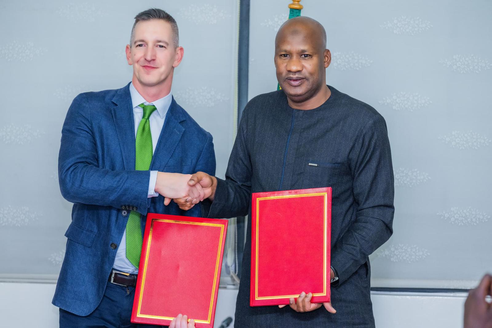 Photo of CIFF's Executive Director for SRHR, Miles Kemplay, with Dr. Ibrahima Sy, Minister of Health and Public Hygiene for Senegal during an official partnership declaration.