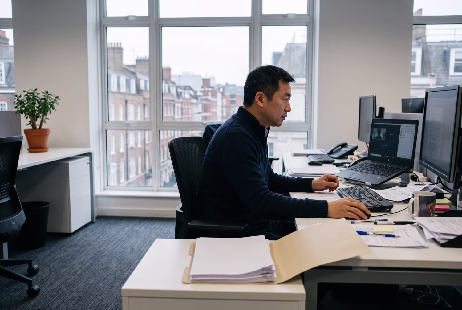 IT support specialist in London office during virtual meeting