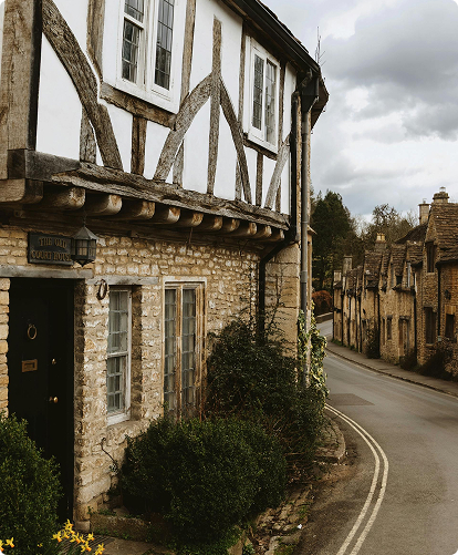 A traditional beamed cottage, The Old Court House located in the Cotswold village of Castle Combe.