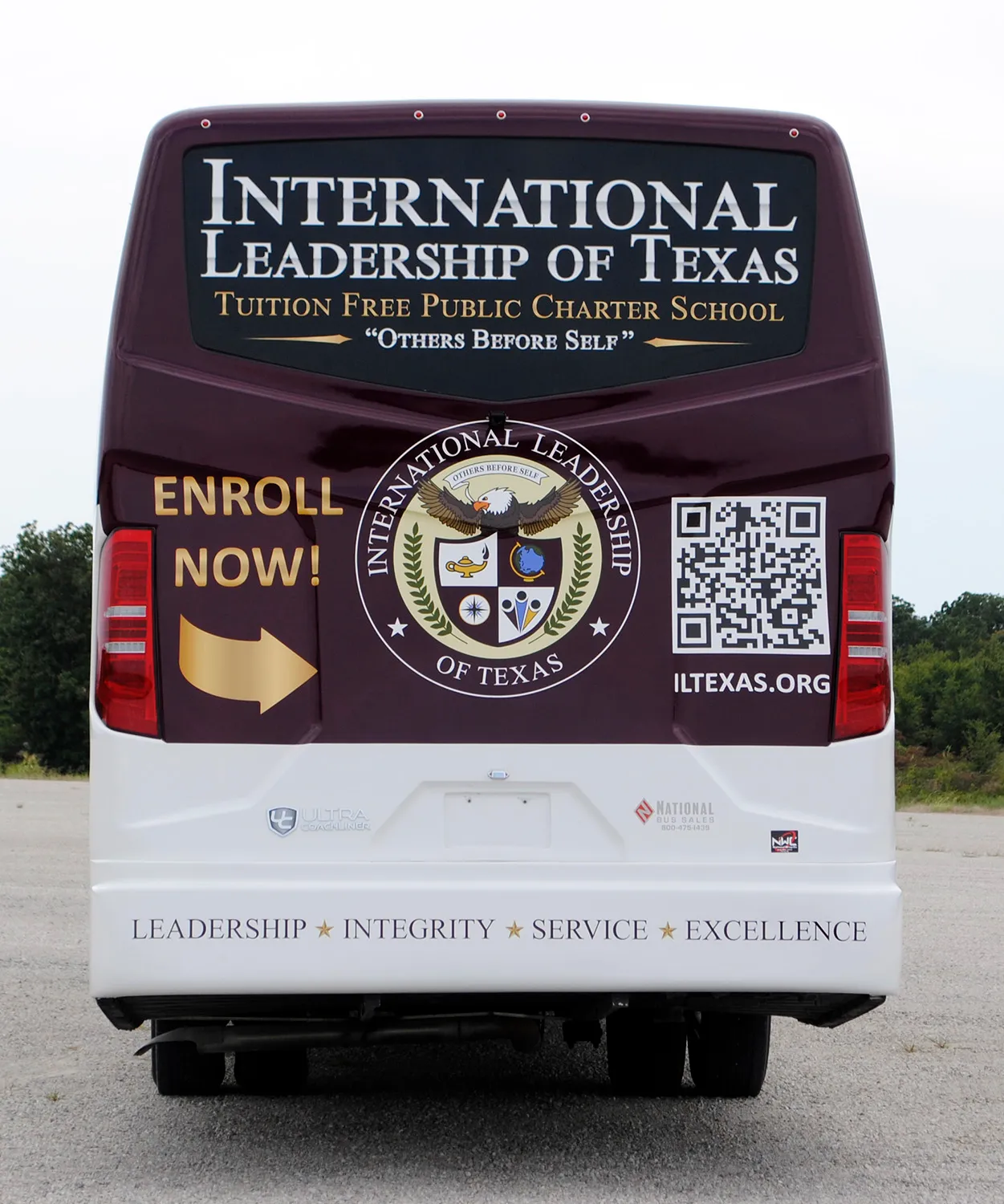 Rear view of a International Leadership of Texas Ultra Coachliner wrapped by National Wrap Co.