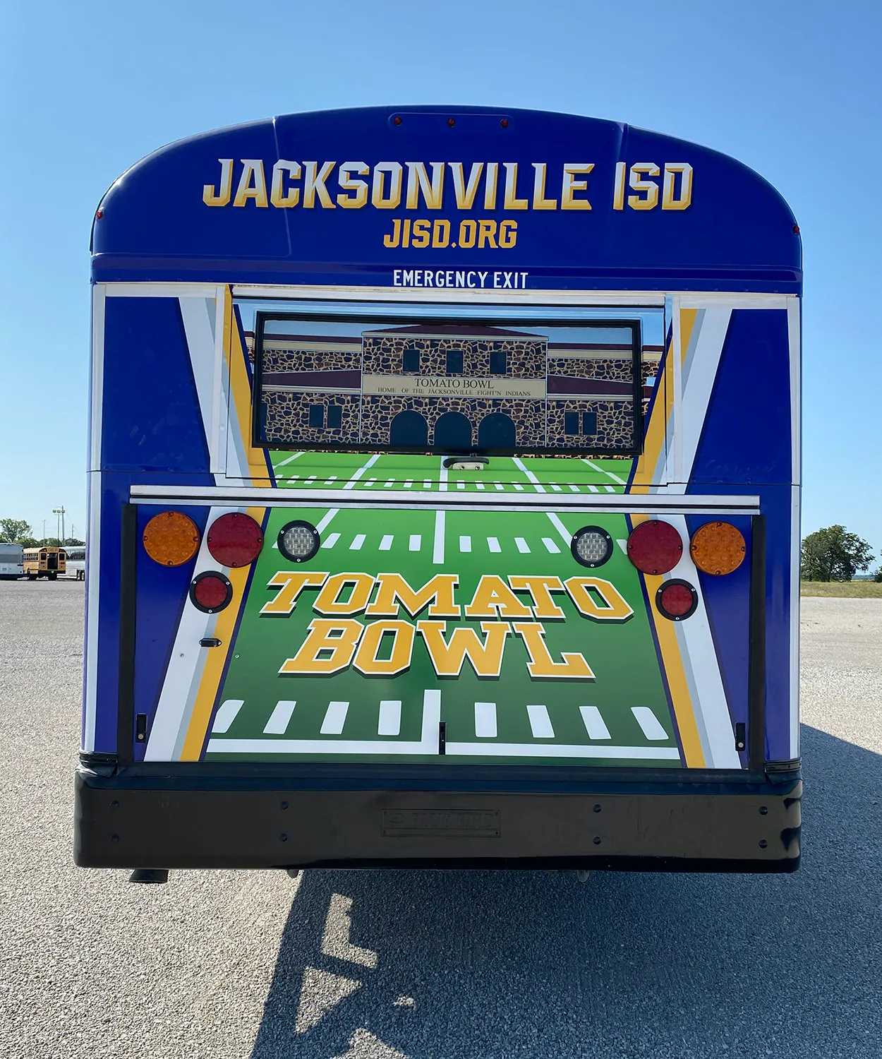 Rear view of a Jacksonville ISD bus wrapped by National Wrap Co.