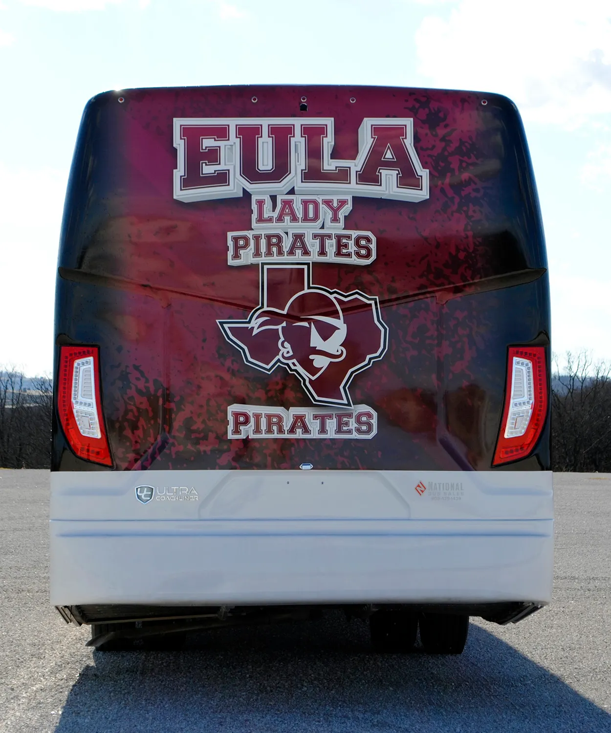 Rear view of a Eula Lady Pirates and Pirates Ultra Coachliner wrapped by National Wrap Co.