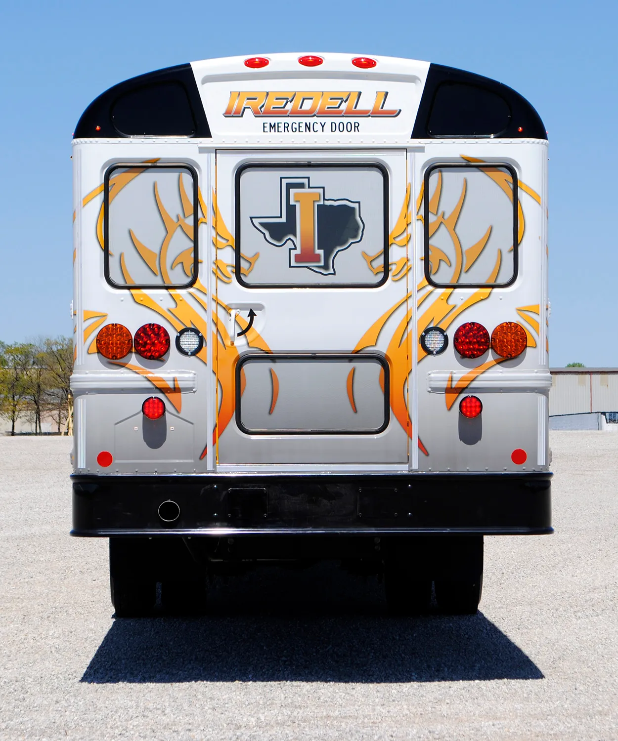 Rear view of a Iredell ISD bus wrapped by National Wrap Co.