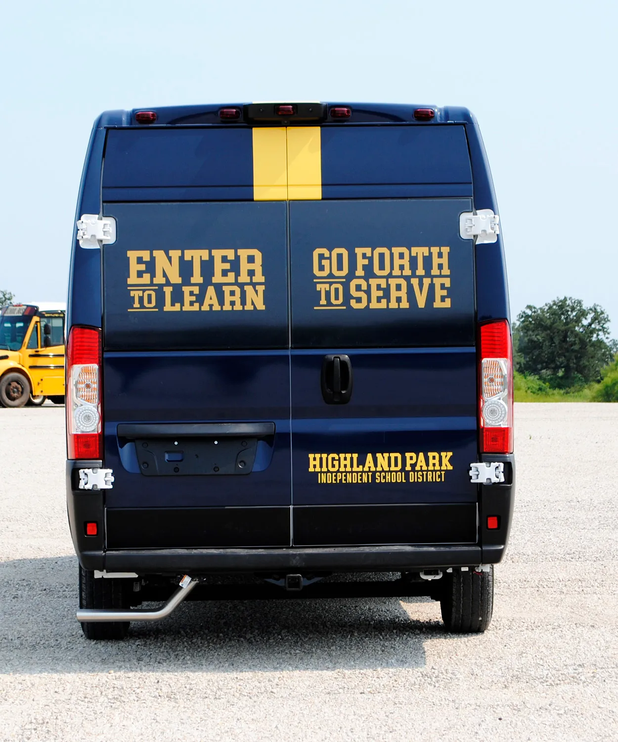 Rear view of a Highland Park Scots shuttle wrapped by National Wrap Co.