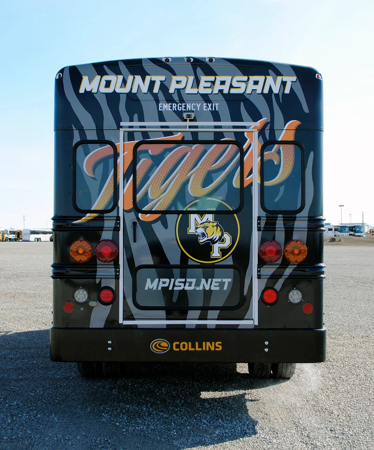 Rear view of a Mount Pleasant bus wrapped by National Wrap Co.