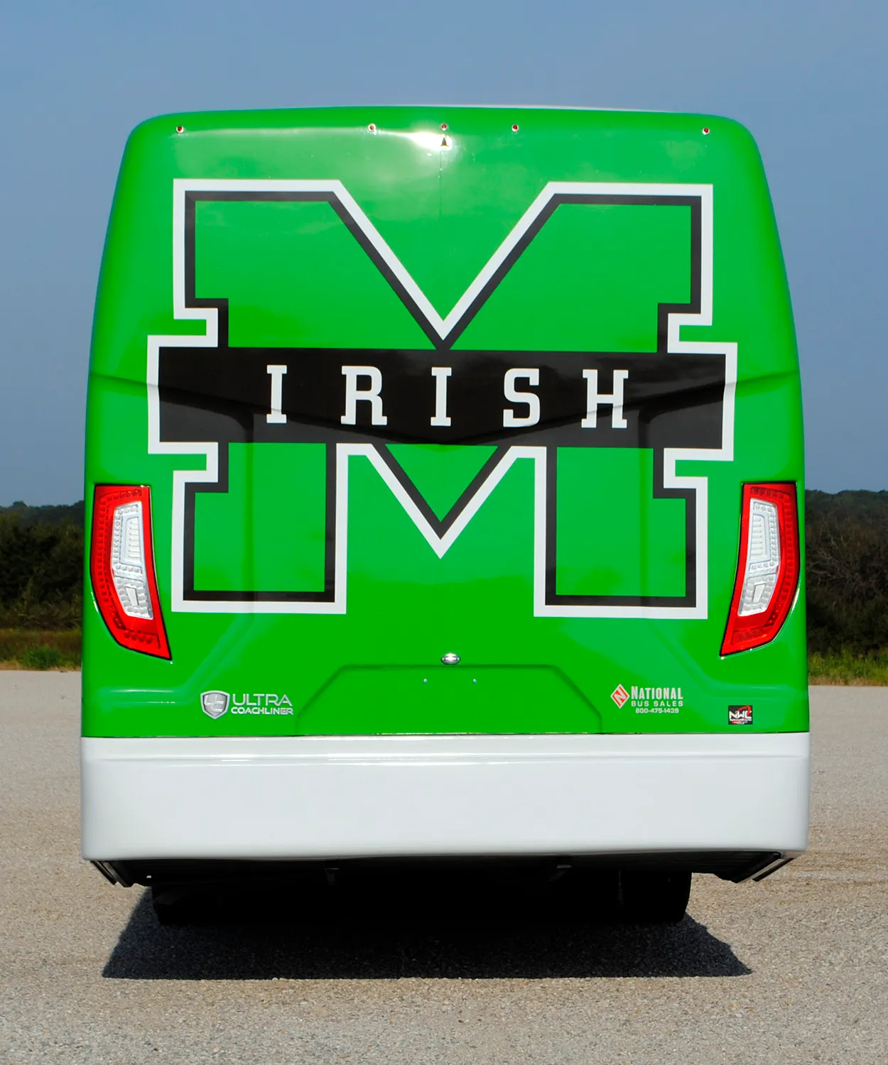 Rear view of a Bishop McGuinness Ultra Coachliner wrapped by National Wrap Co.