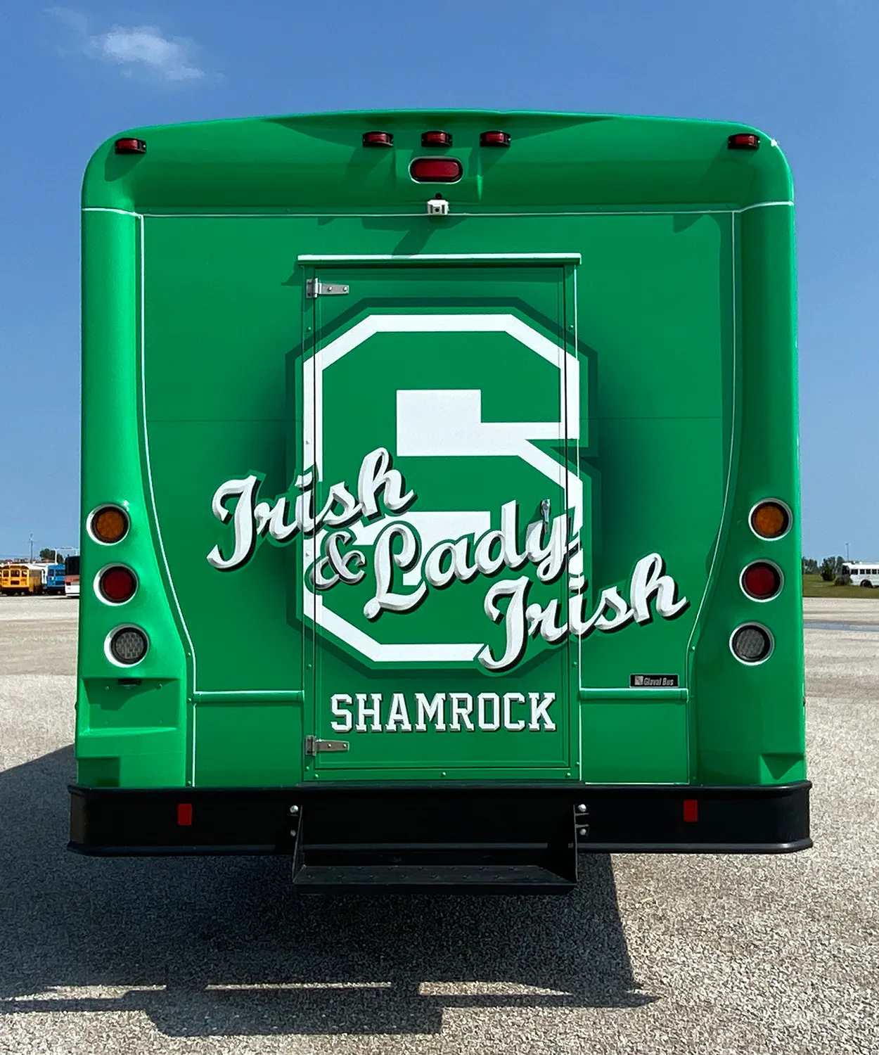 Rear view of a Irish and Lady Irish bus wrapped by National Wrap Co.
