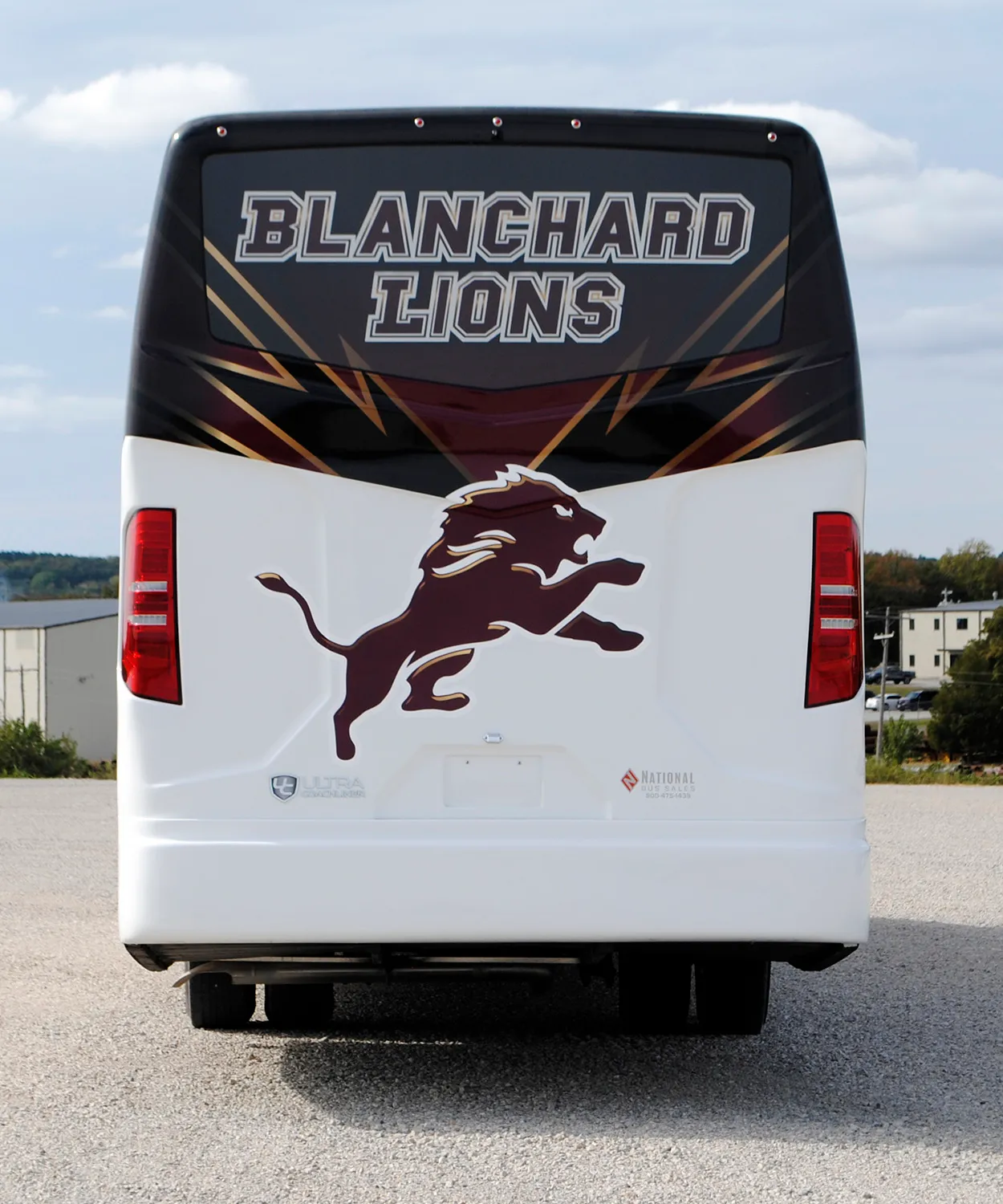Rear view of a Blanchard Lions Ultra Coachliner wrapped by National Wrap Co.