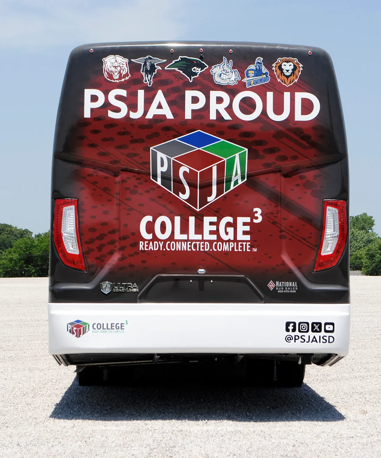 Rear view of a Pharr-San Juan-Alamo ISD Ultra Coachliner wrapped by National Wrap Co.