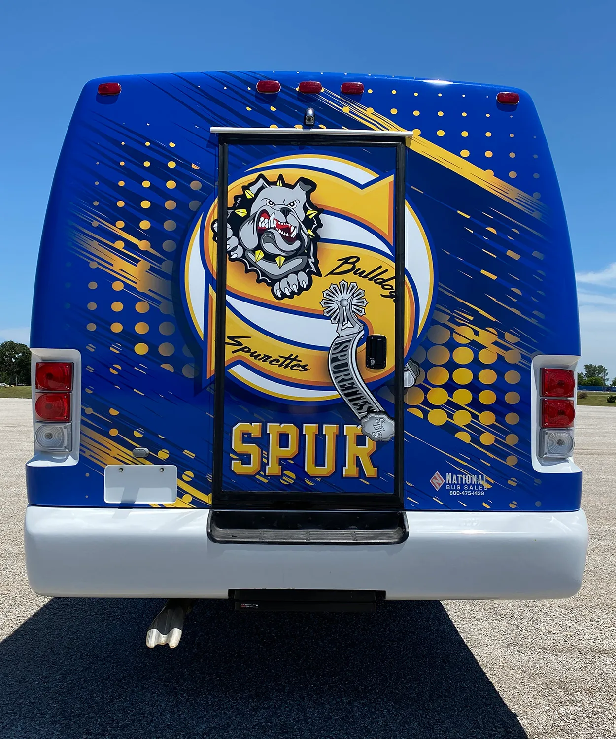 Rear view of a Spur Bulldogs Ultra Coachliner wrapped by National Wrap Co.