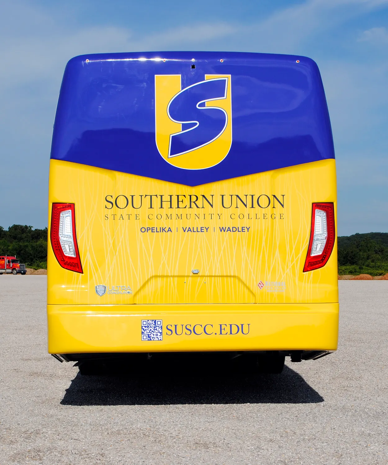Rear view of a Southern Union State Community College Ultra Coachliner wrapped by National Wrap Co.