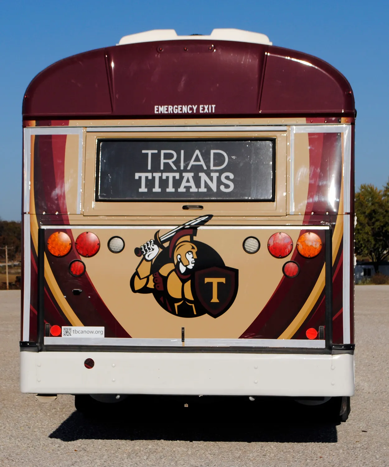 Rear view of a Triad Titans bus wrapped by National Wrap Co.