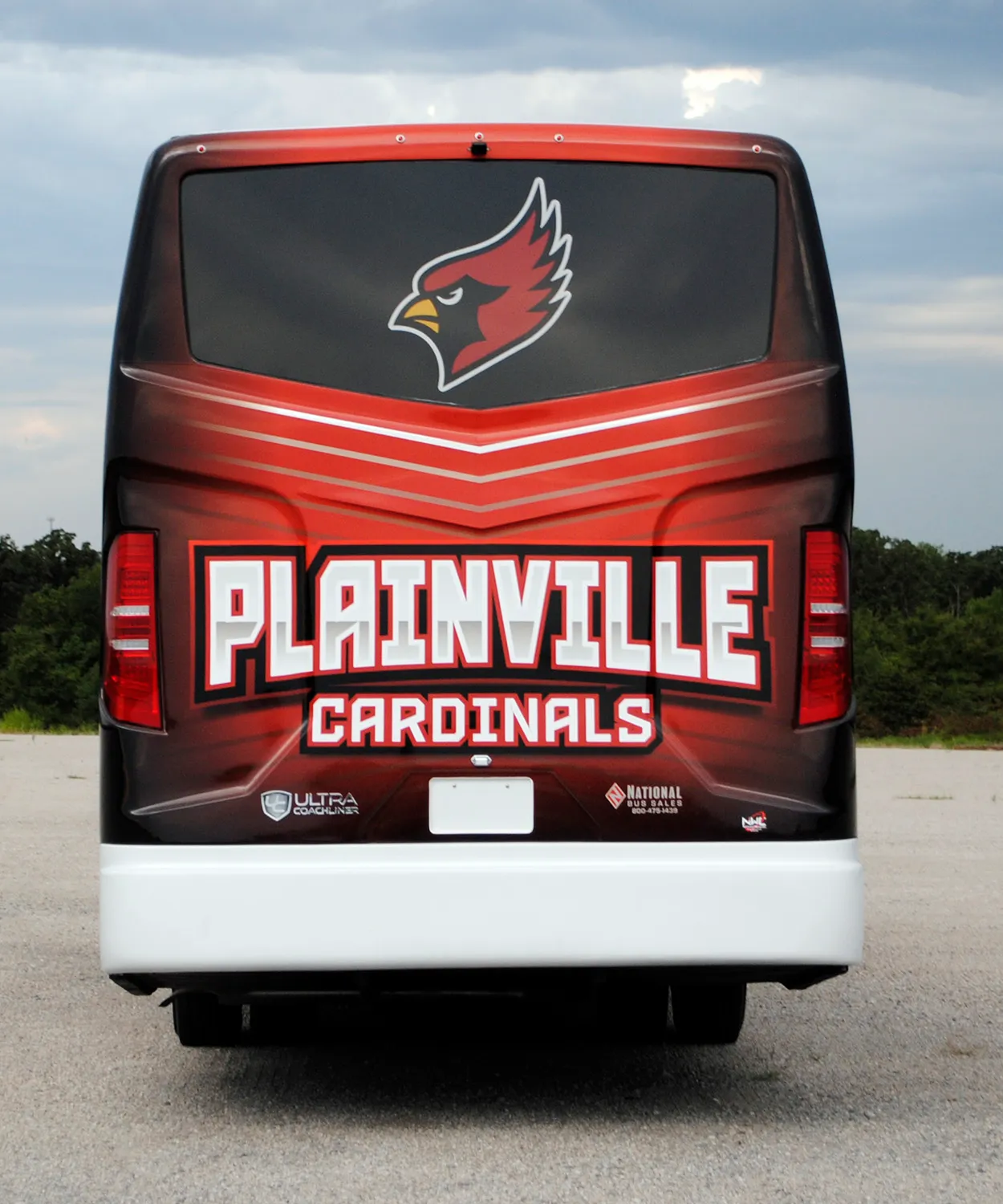 Rear view of a Plainville Cardinals Ultra Coachliner wrapped by National Wrap Co.