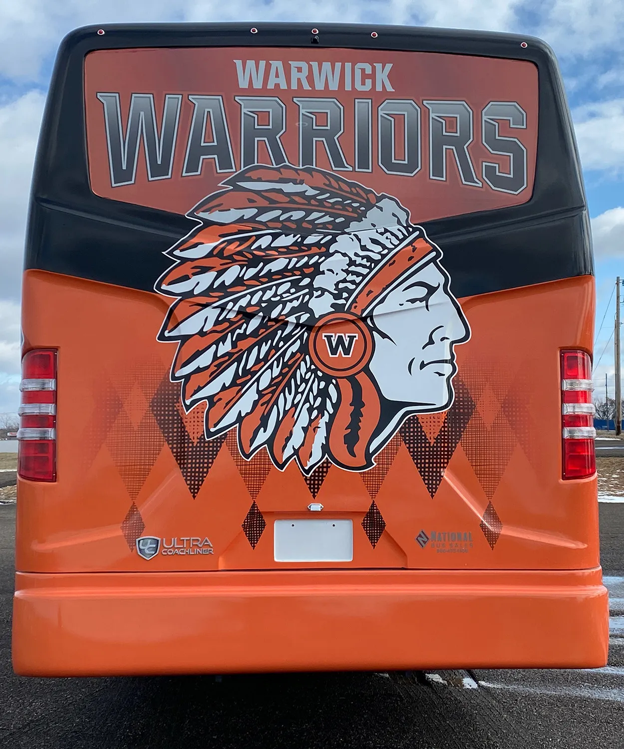 Rear view of a Warwick Warriors Ultra Coachliner wrapped by National Wrap Co.