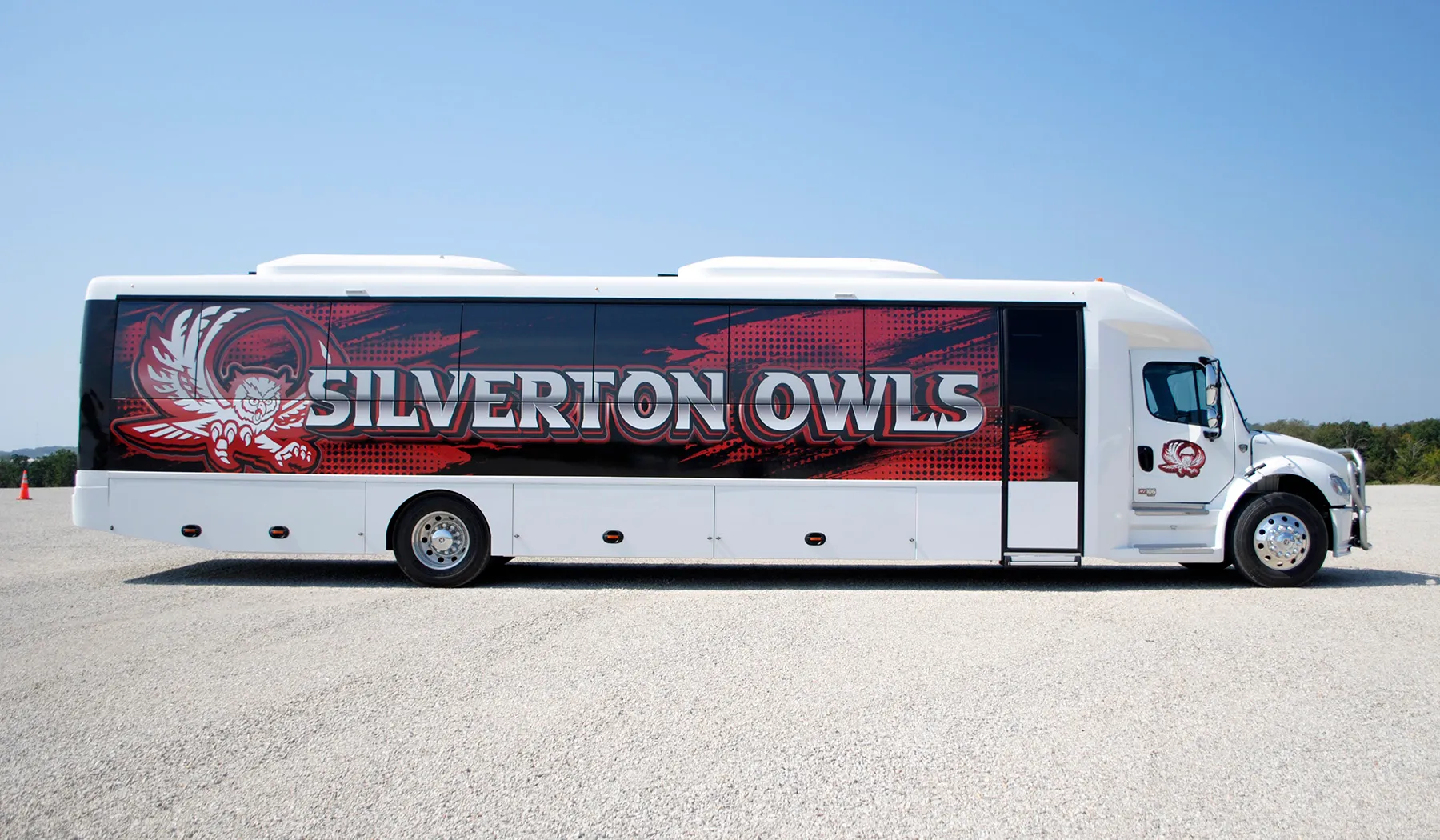 Side view of a Silverton Owls Ultra Coachliner wrapped by National Wrap Co.