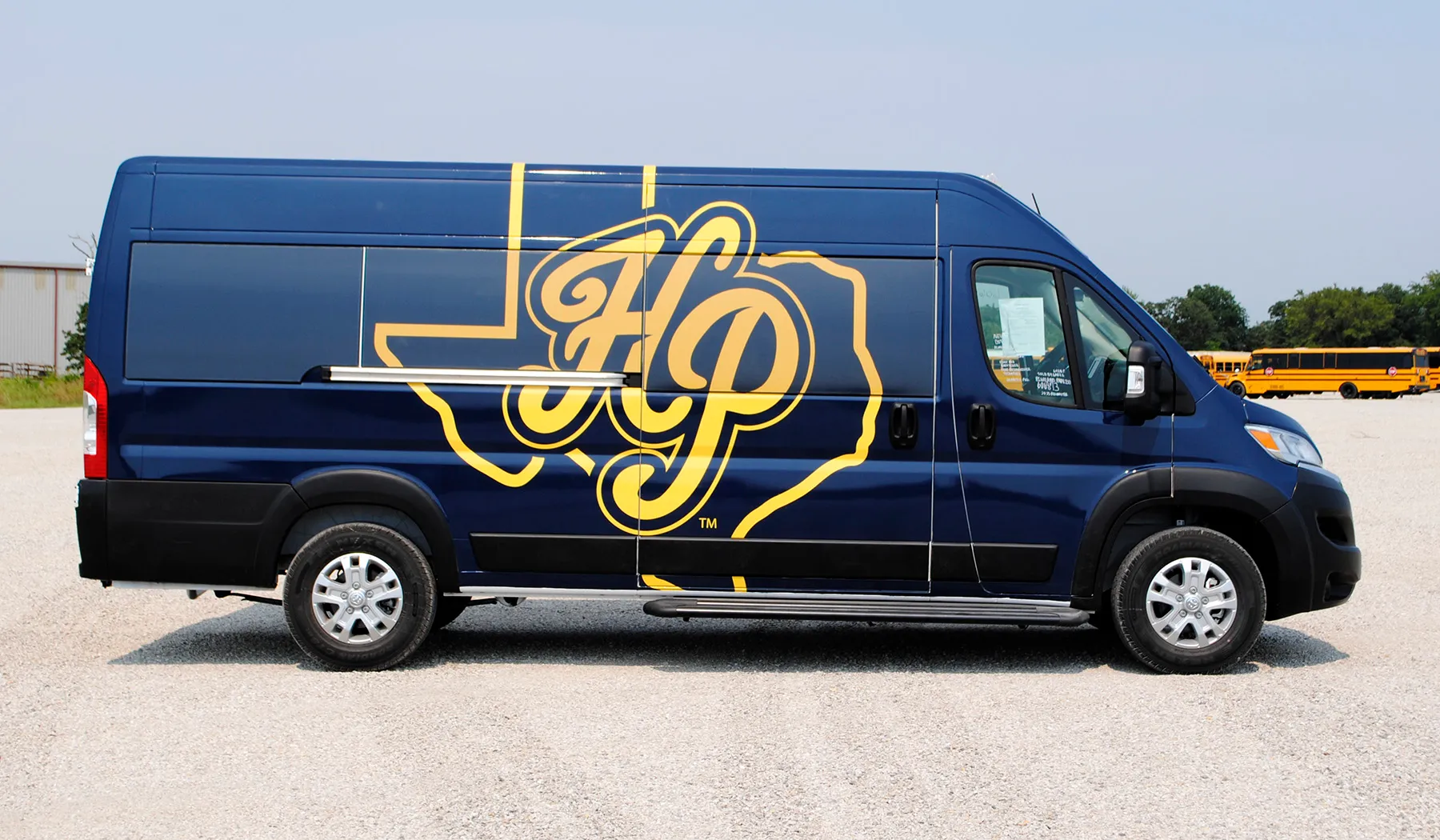 Side view of a Highland Park Scots shuttle wrapped by National Wrap Co.