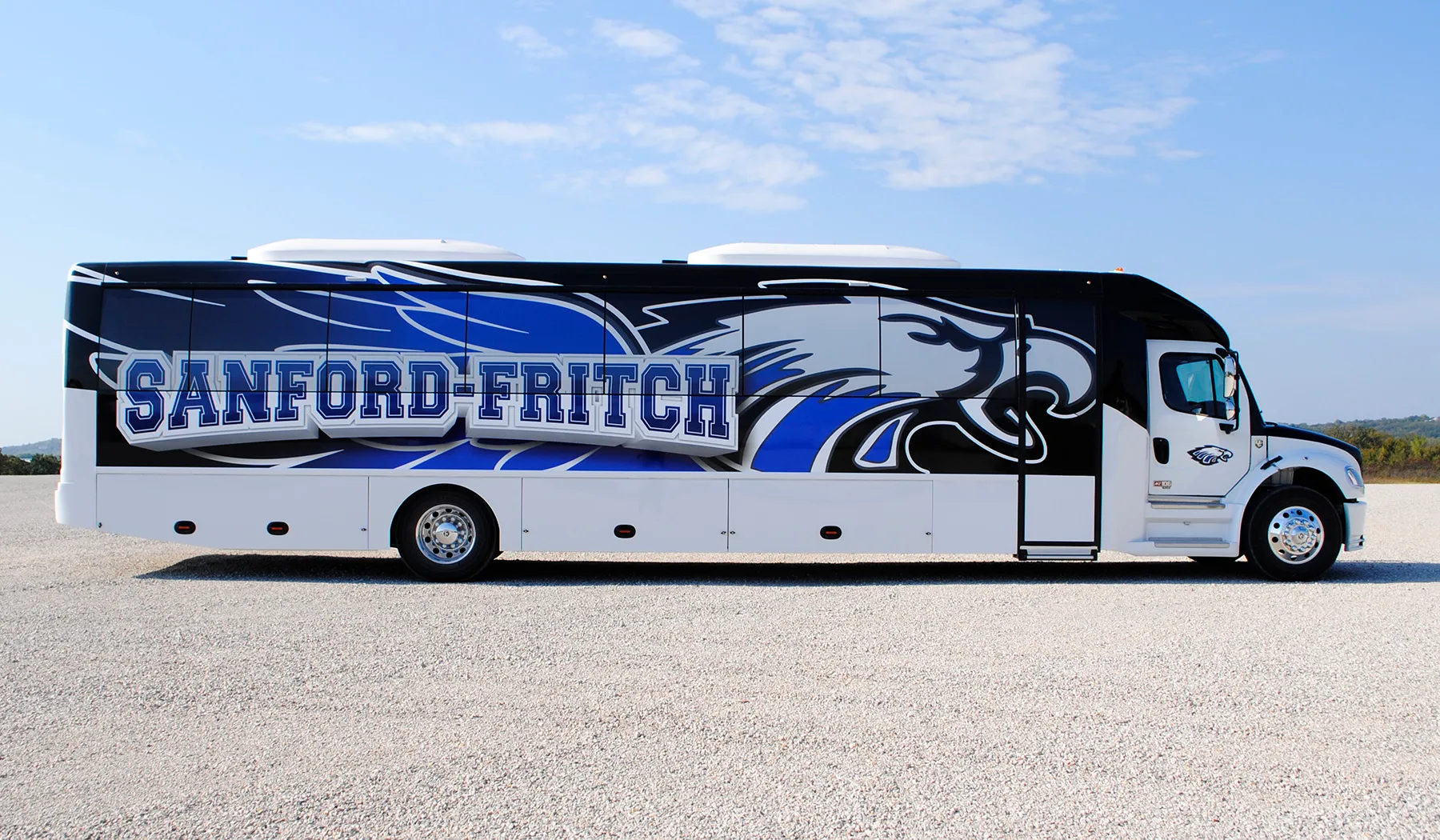 Side view of a Sanford-Fritch Ultra Coachliner wrapped by National Wrap Co.